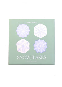 A square mint green product box for 'PROCCWORK' brand 'SNOWFLAKES' cocktail mixers, featuring four stylized snowflake illustrations in light purple and white on the front.