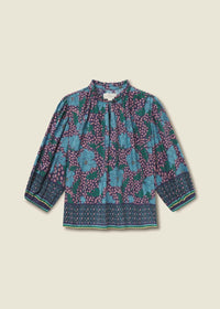 Long-sleeve top with floral pattern on a beige background