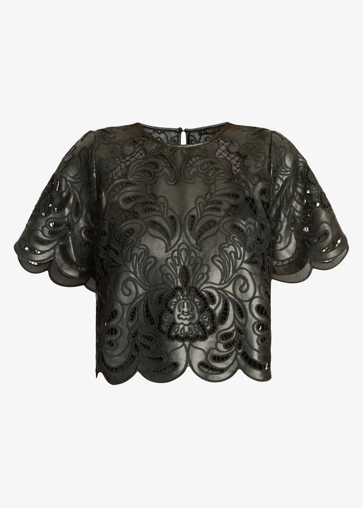 A black sheer mesh top with intricate floral lace applique and a central lion head motif, featuring short puff sleeves and a scalloped hem, shown against a light gray background.