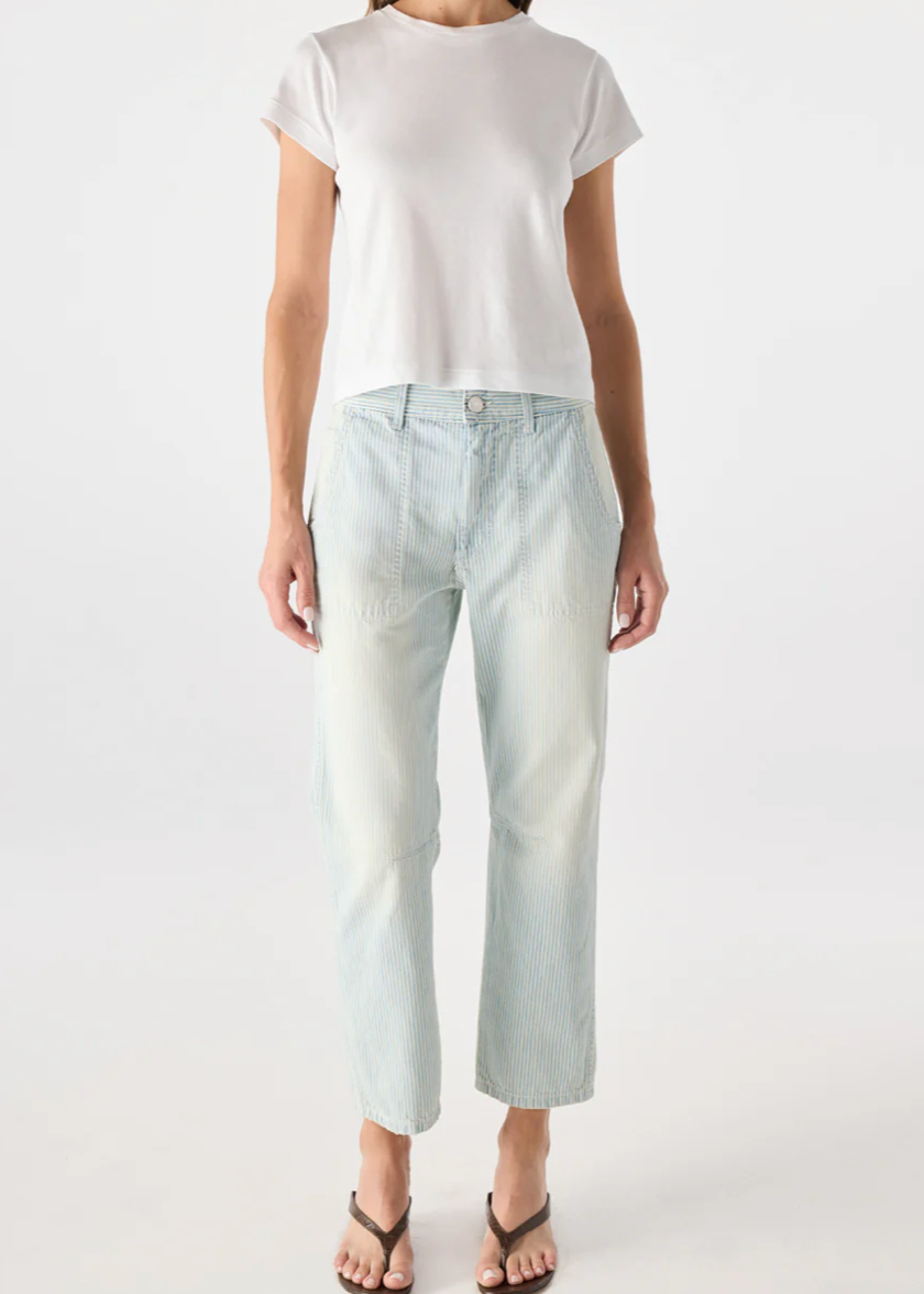 Person wearing a white t-shirt and light blue jeans on a white background