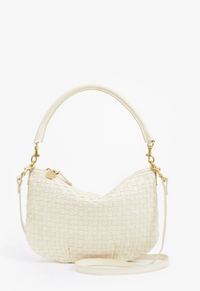 Cream-colored woven handbag with gold accents on a white background