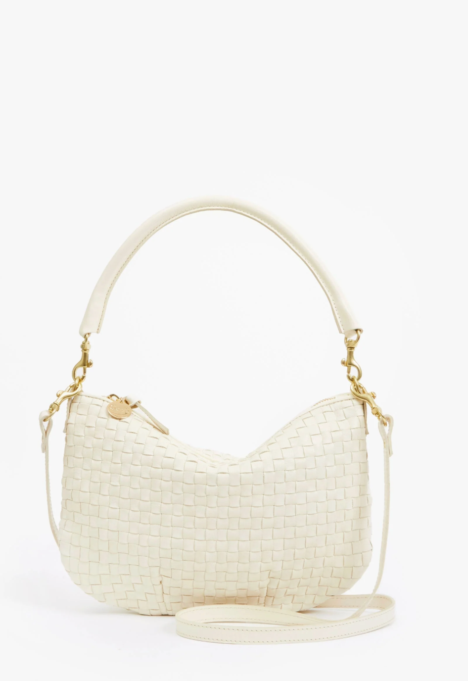 Cream-colored woven handbag with gold accents on a white background