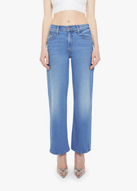 Person wearing blue jeans on a white background
