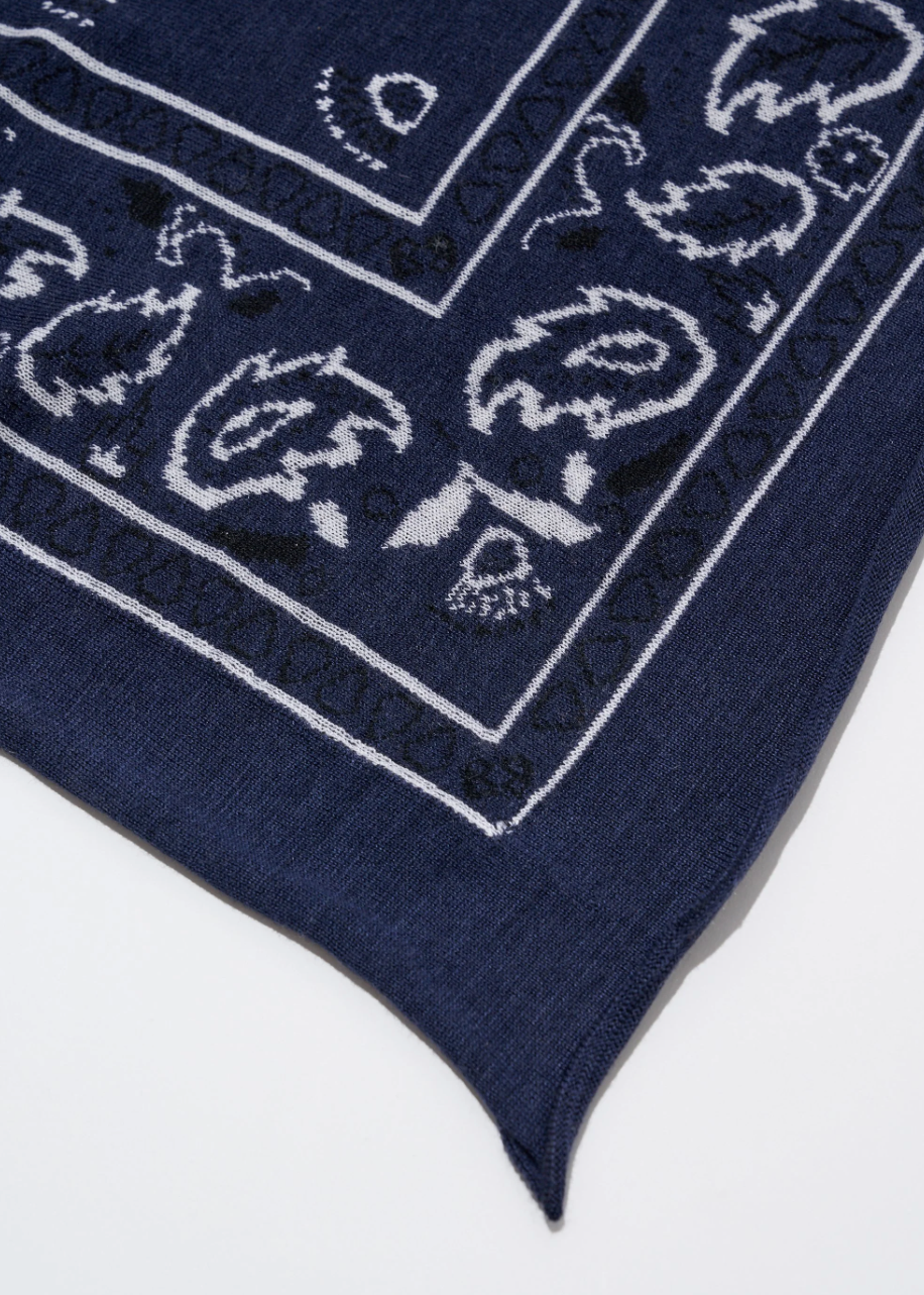 Navy blue bandana with white paisley patterns on a white background