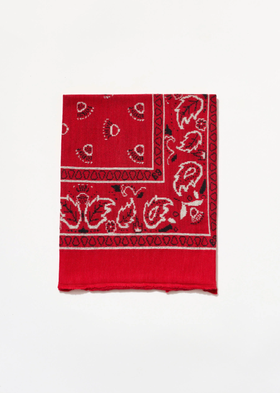 Red bandana with black and white pattern on a white background