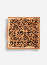 A square scarf with a leopard print pattern in shades of brown, black, and tan, finished with a solid tan border and stitched edges, shown flat against a light gray background.