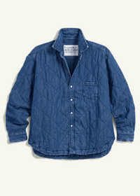A blue quilted denim button-up shirt by Frank & Eddie, featuring a diamond-quilted pattern, chest pocket, and white buttons, laid flat against a light cream background.