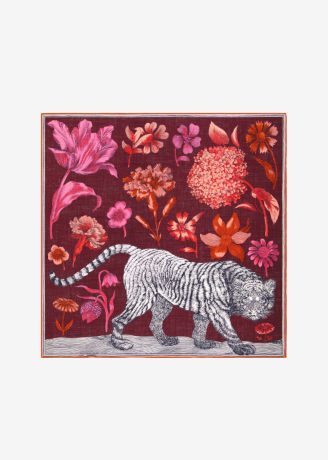 A square scarf featuring a white tiger with black stripes walking across a floral field on a deep burgundy background, bordered by a thin orange line, shown against a light gray background.