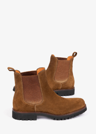 A pair of brown suede Chelsea boots with elastic side panels and black lug soles, photographed on a clean white background.