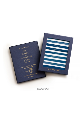 A boxed set of six E. Frances envelopes, shown with one navy envelope and one matching navy card holder displaying six blue-and-white striped envelopes, on a clean white background.