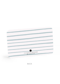 A rectangular card with little wavy blue lines.  Indicates back of card.