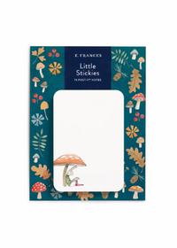 A pack of E. Frances 'Little Stickies' 75 post-it notes, featuring a whimsical forest illustration border with colorful mushrooms, leaves, and a rabbit under a mushroom cap on a white background.