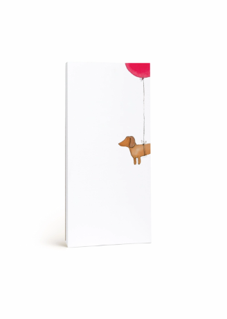 A tall, narrow white notepad featuring a whimsical illustration of a dachshund dog holding a bright pink balloon, shown against a clean white background.