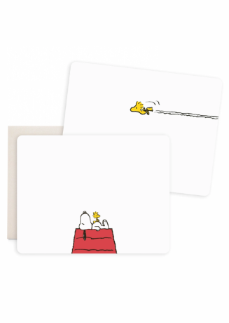 A set of white rectangular cards or envelopes with rounded corners, shown overlapping on a light gray background. The front card features a small Peanuts-style illustration of Snoopy and Woodstock on a red dog bed, and the back card shows a small yellow bird flying with a trail behind it.
