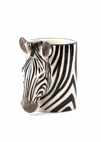A ceramic pencit pot shaped like a zebra head, featuring a black and white striped pattern with a realistic zebra nose and ears, set against a plain white background.