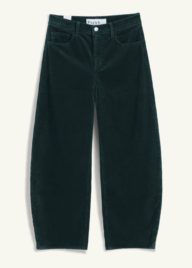 Dark green corduroy pants with a relaxed, wide-leg fit, displayed flat against a light cream background. The brand name 'frank' is visible on the inner waistband label.