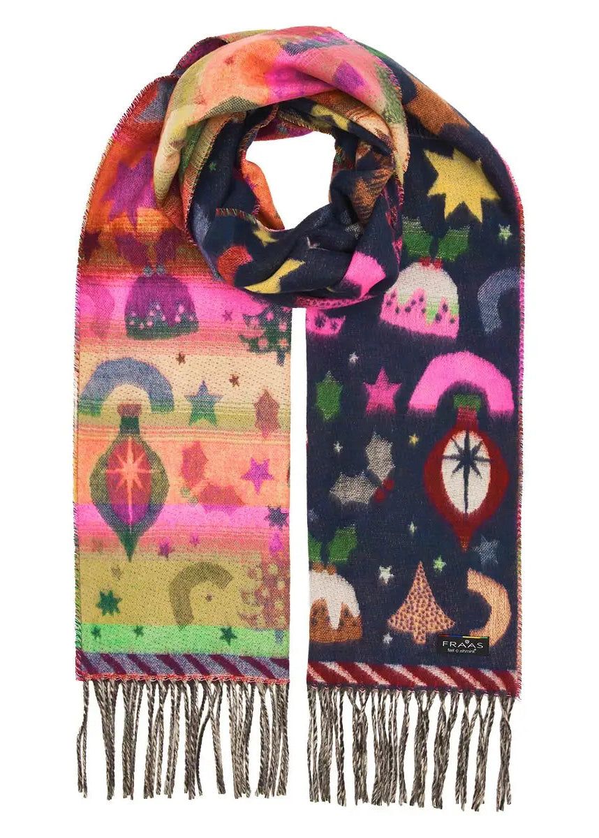 A multicolor patterned scarf with fringe, featuring whimsical illustrations of stars, moons, rainbows, and decorative shapes on a white marble background.