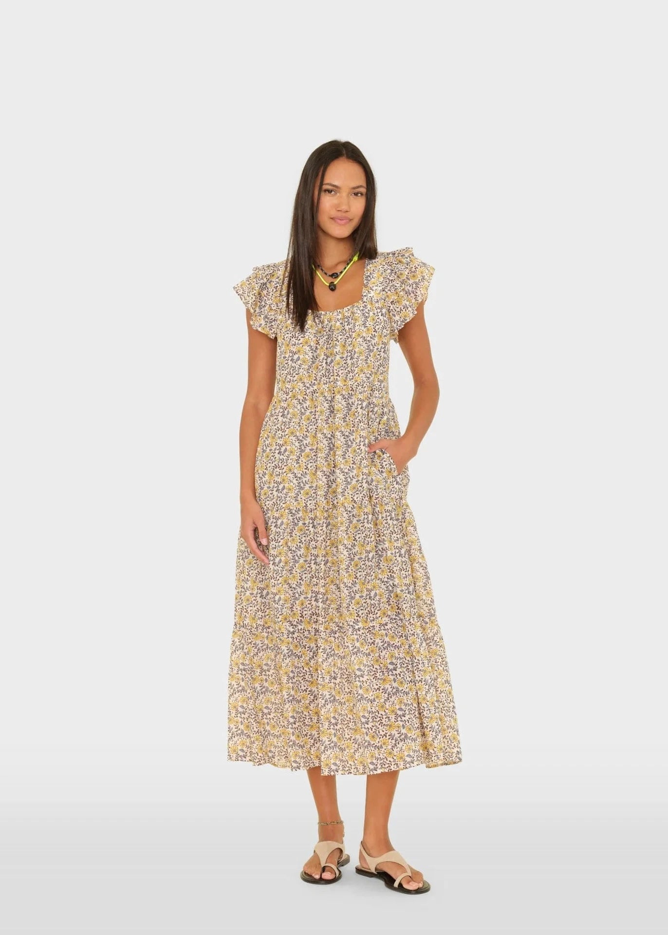 Woman wearing a floral dress on a white background